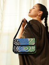Iris Baguette Bag with Handle by The Tan Clan, stylish leather handbag featuring a sleek design and top handle for versatile carrying.