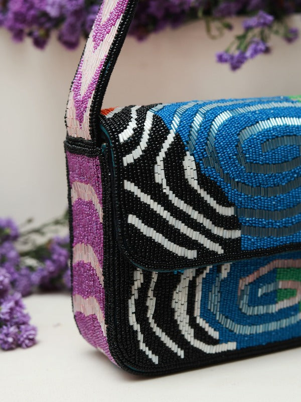 Iris Baguette Bag with Handle by The Tan Clan, featuring a sleek design and top handle, made from durable materials.