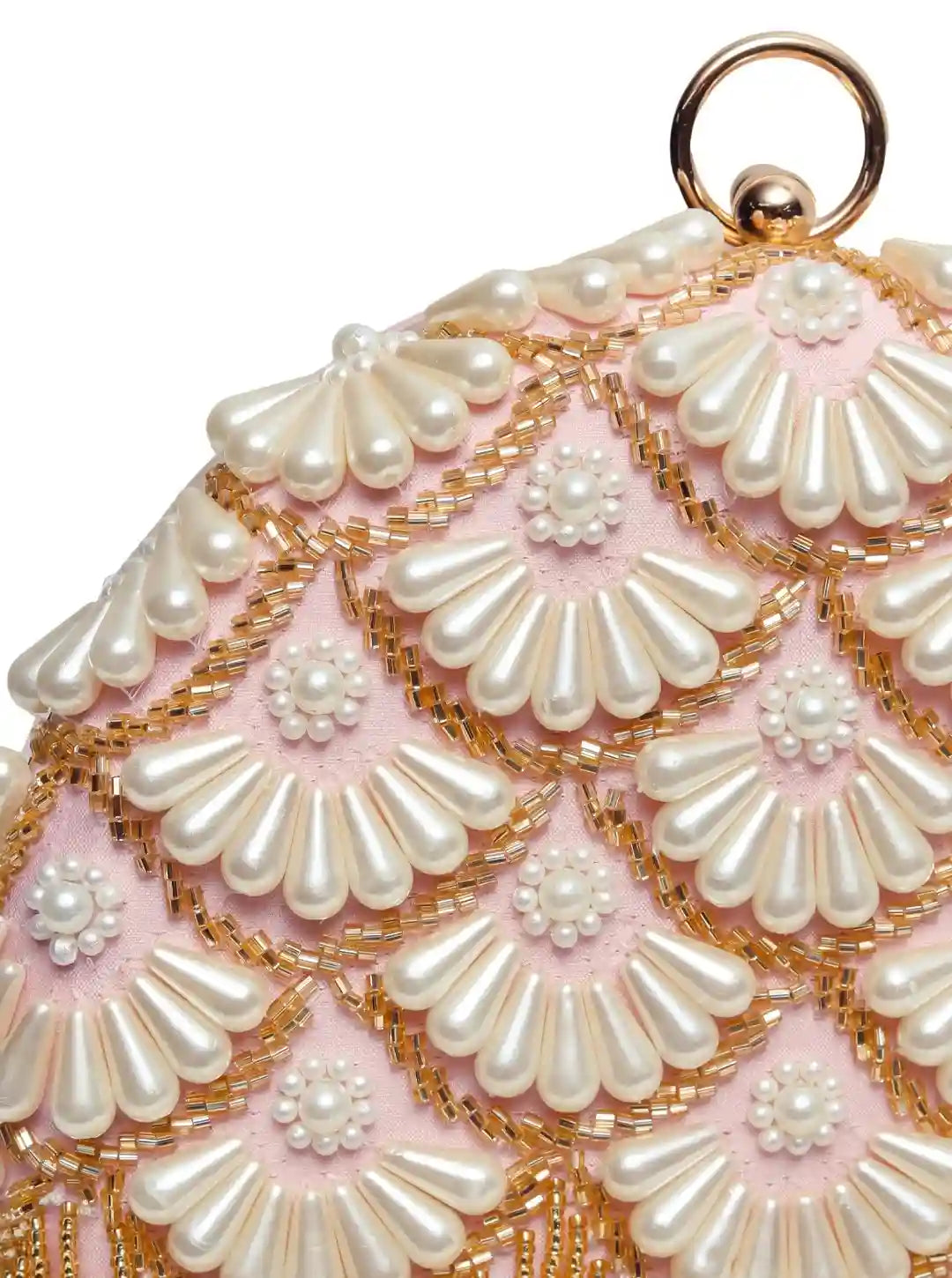Round hand-embroidered clutch with tassels by The Tan Clan, featuring intricate embroidery and decorative tassles.