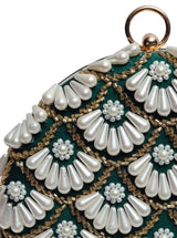Round hand-embroidered clutch with tassels from The Tan Clan featuring intricate embroidery and colorful design.