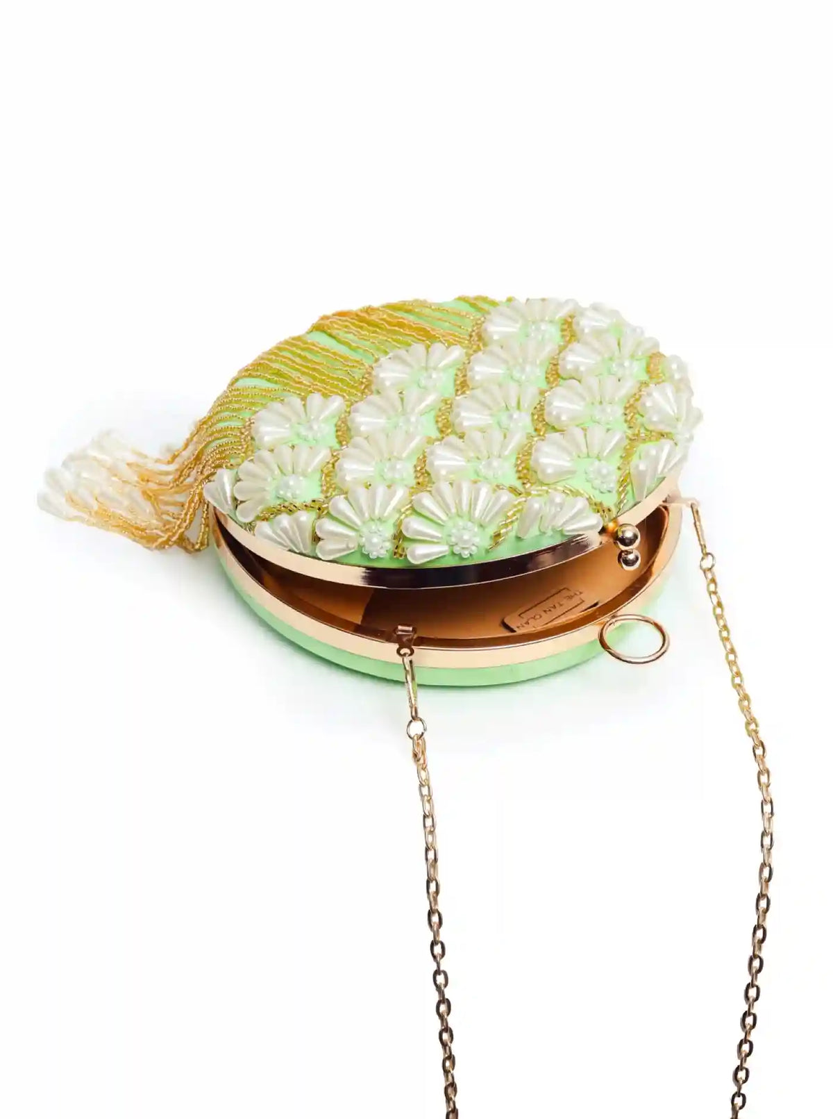 Round hand-embroidered clutch by The Tan Clan with tassels, featuring intricate embroidery and a compact, stylish design.