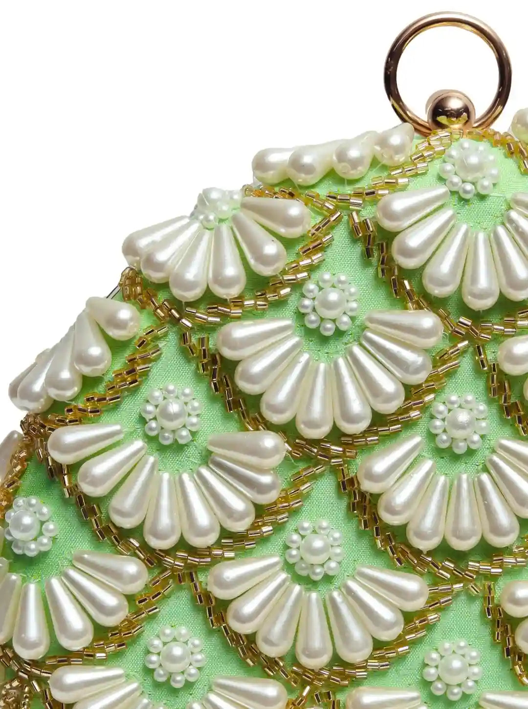 Round hand-embroidered clutch with tassels from The Tan Clan featuring intricate embroidery and stylish design.
