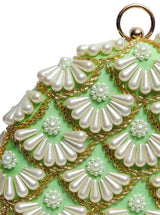 Round hand-embroidered clutch with tassels from The Tan Clan featuring intricate embroidery and stylish design.