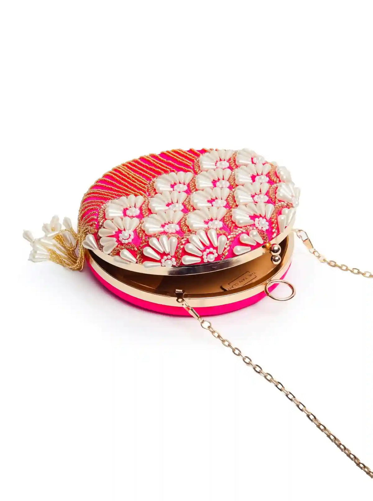 Round hand-embroidered clutch bag with tassels by The Tan Clan, featuring intricate embroidery and a stylish design.