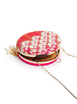 Round hand-embroidered clutch bag with tassels by The Tan Clan, featuring intricate embroidery and a stylish design.