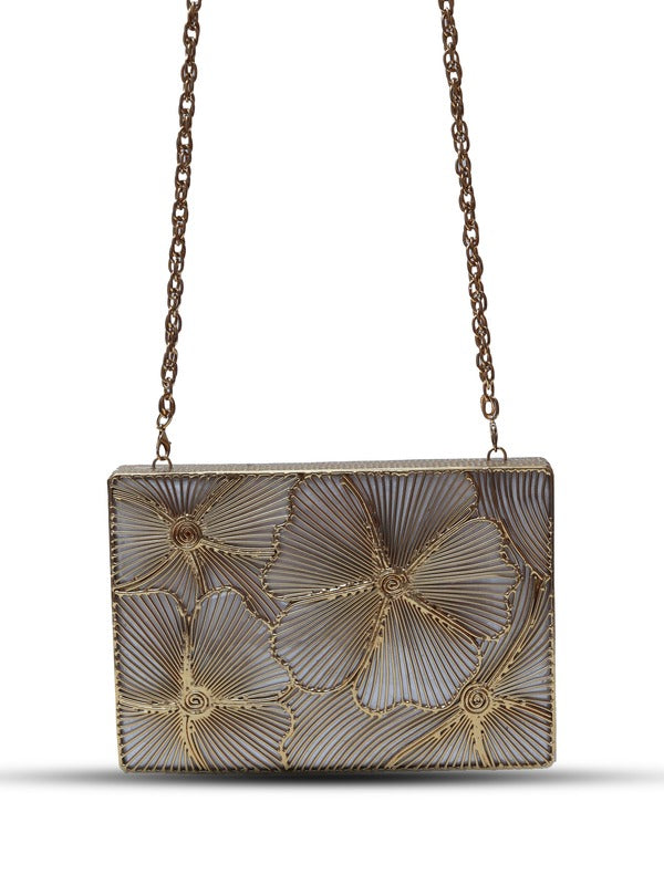 Isa Mother of Pearl Clutch by The Tan Clan featuring a shimmering mother of pearl exterior and sleek design.