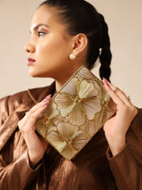 Isa Mother of Pearl Clutch by The Tan Clan featuring a shimmering pearl exterior and elegant design for evening occasions.