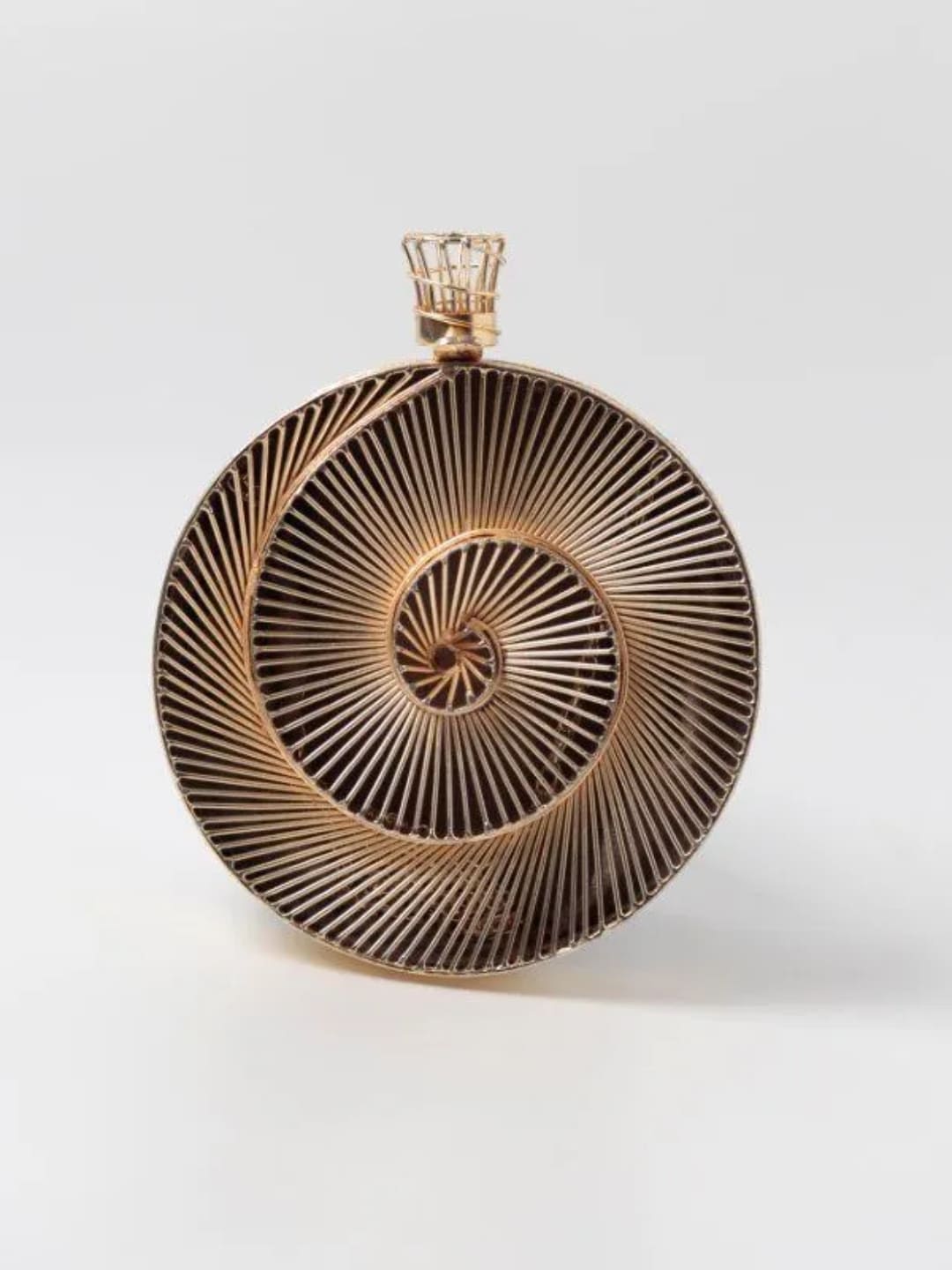 Isha brass wirework clutch bag with intricate design from The Tan Clan, showcasing detailed metal craftsmanship.