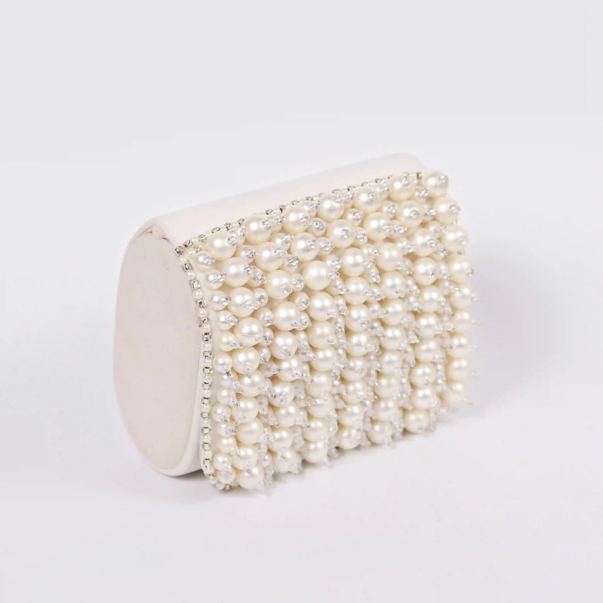 Jade mini bag from The Tan Clan with an embroidered handle, featuring a compact design and stylish details.