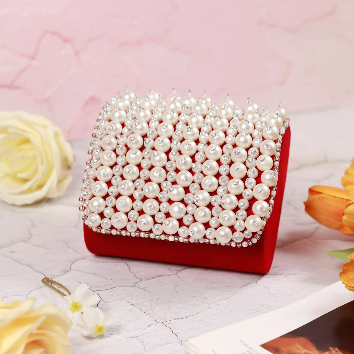 Jade mini bag with embroidered handle by The Tan Clan, featuring a compact design and detailed stitched handle.