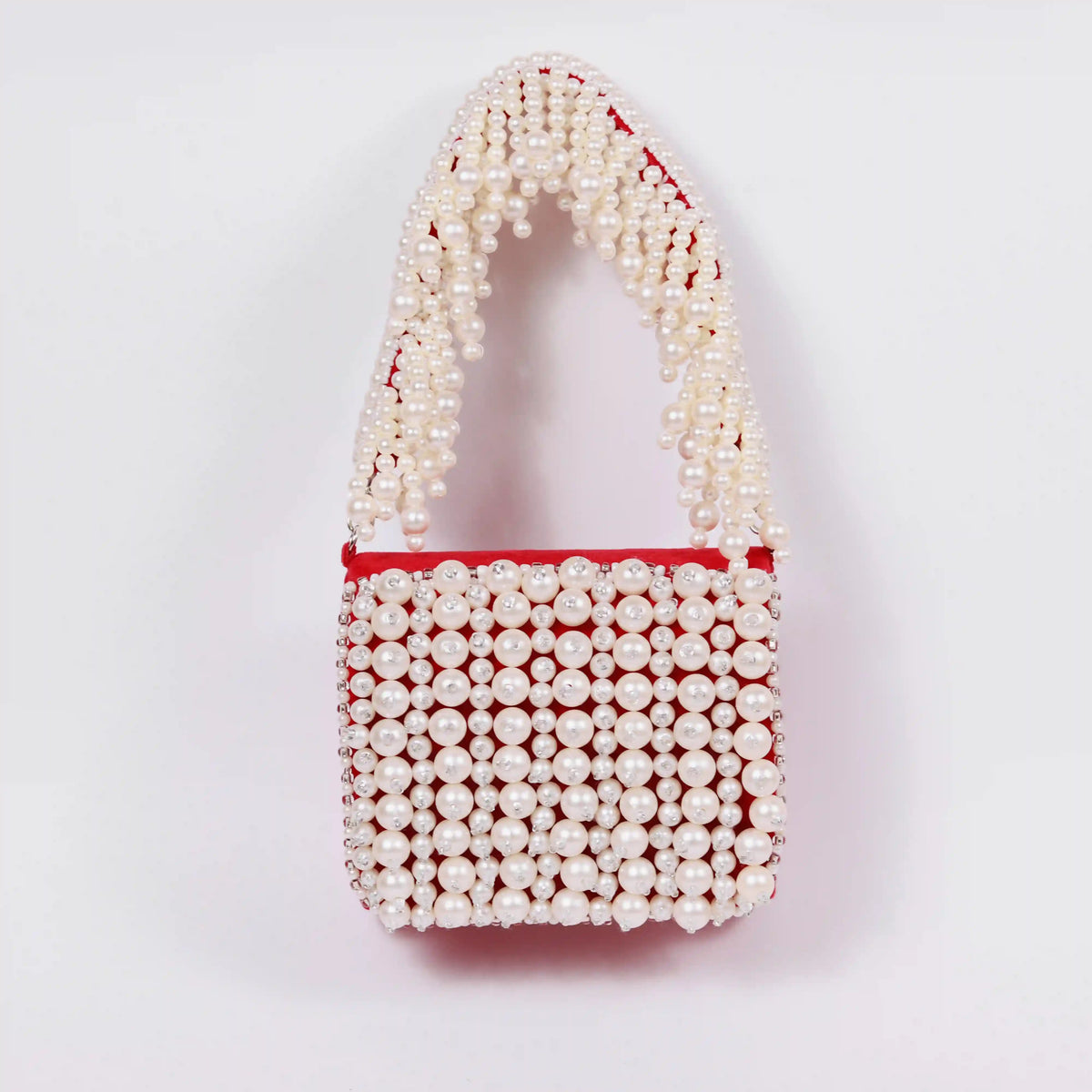 Jade Mini Bag by The Tan Clan featuring an embroidered handle and compact design for stylish everyday use.