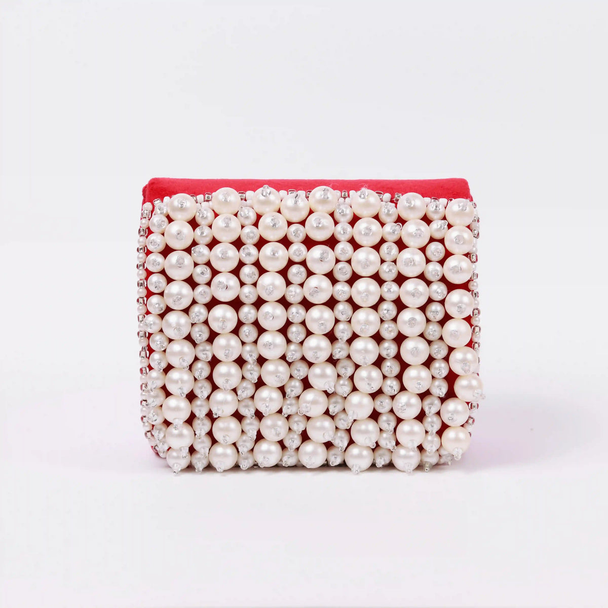 Jade mini bag by The Tan Clan with embroidered handle, featuring a compact design and detailed embroidery on the strap.