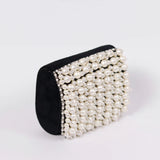 Jade mini bag by The Tan Clan featuring an embroidered handle and compact design for stylish everyday use.