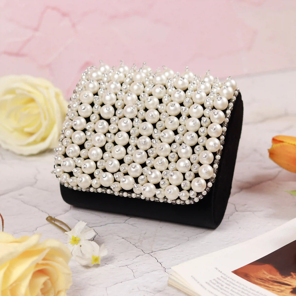 Jade mini bag by The Tan Clan with embroidered handle, featuring a compact design and stylish detailing.