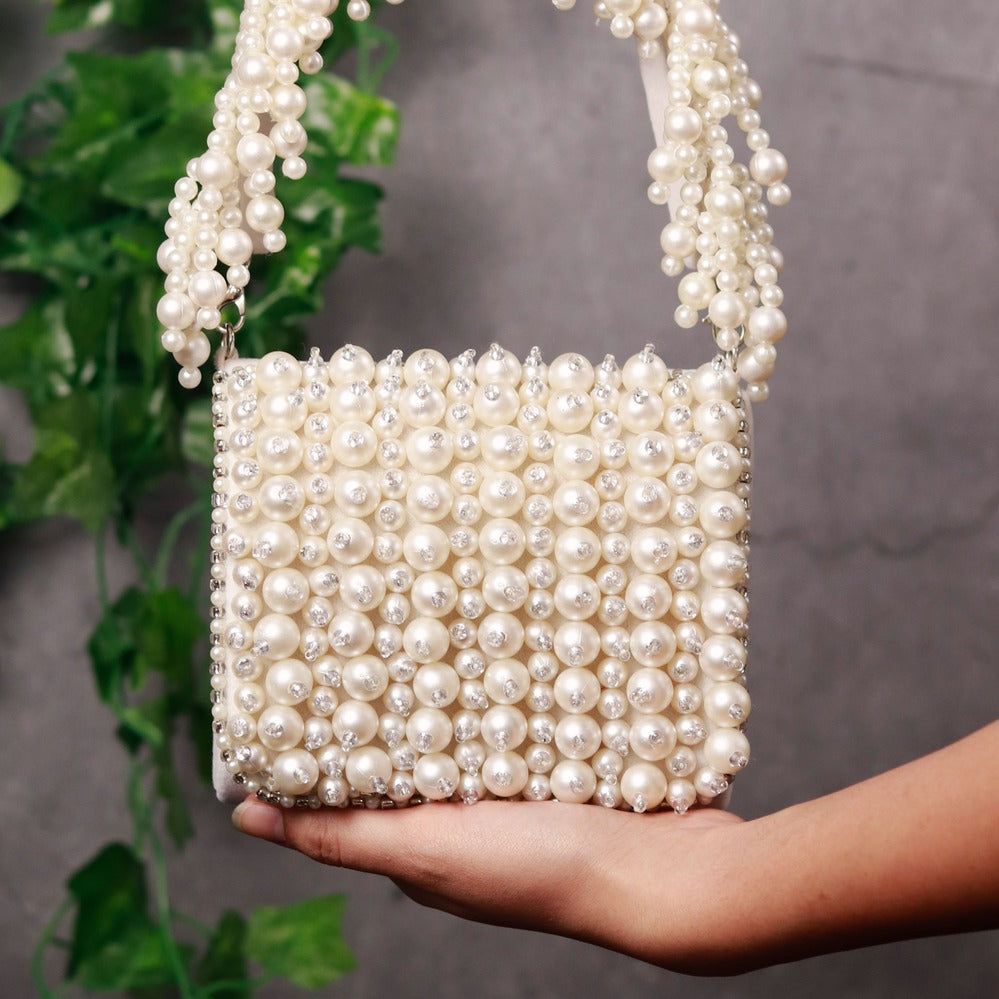 Jade mini bag by The Tan Clan featuring an embroidered handle and compact design, perfect for stylish everyday use.