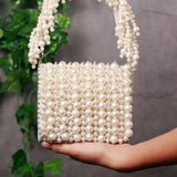 Jade mini bag by The Tan Clan featuring an embroidered handle and compact design, perfect for stylish everyday use.