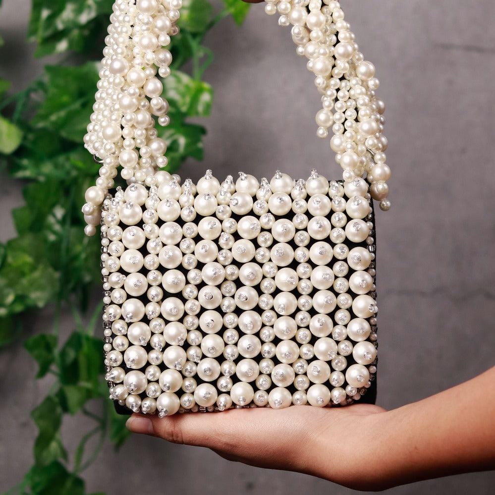 Jade mini bag by The Tan Clan featuring an embroidered handle and compact design, perfect for stylish, everyday use.
