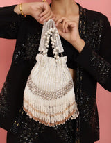 Handcrafted Jalsa Potli Bag with handle by The Tan Clan, featuring traditional embroidery and fabric for elegant occasions.