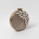 Jannat brass clutch with intricate brass work and mother of pearl detailing, showcasing elegant craftsmanship and traditional design.