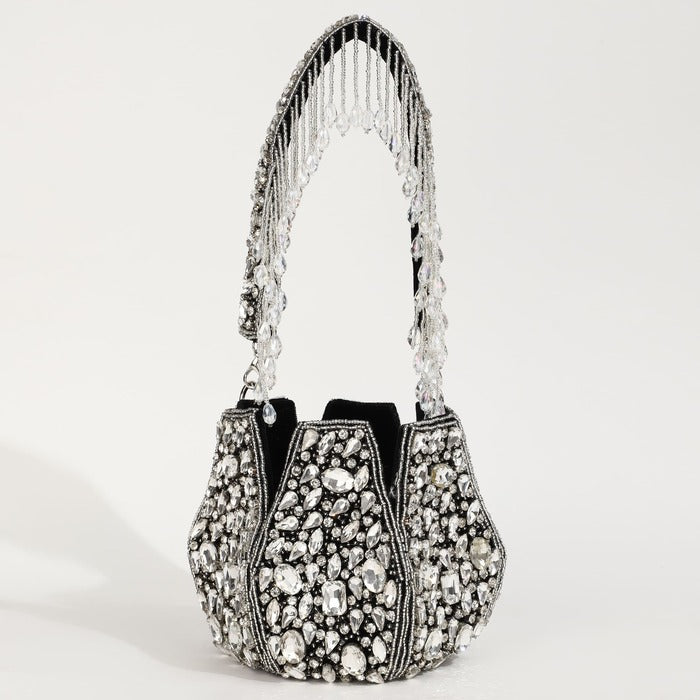 Tan Clan Jhalak potli bag with handle, featuring intricate embroidery and traditional design, suitable for festive occasions.