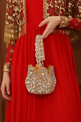 Jhalak Potli bag with handle by The Tan Clan, featuring traditional design and decorative embellishments for festive occasions.