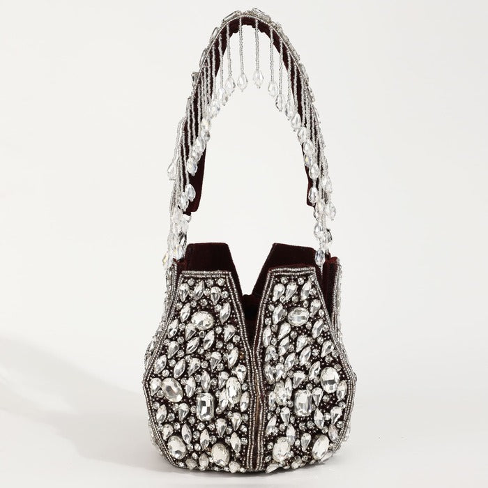 Tan Clan Jhalak Potli Bag with handle featuring intricate embroidery and vibrant design, perfect for traditional or festive occasions.