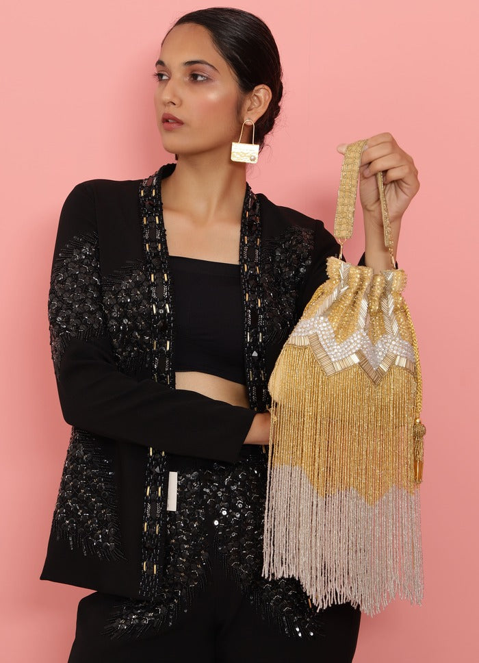 Jhoomar Potli bag with handle in vibrant fabric featuring traditional embroidery, by The Tan Clan.