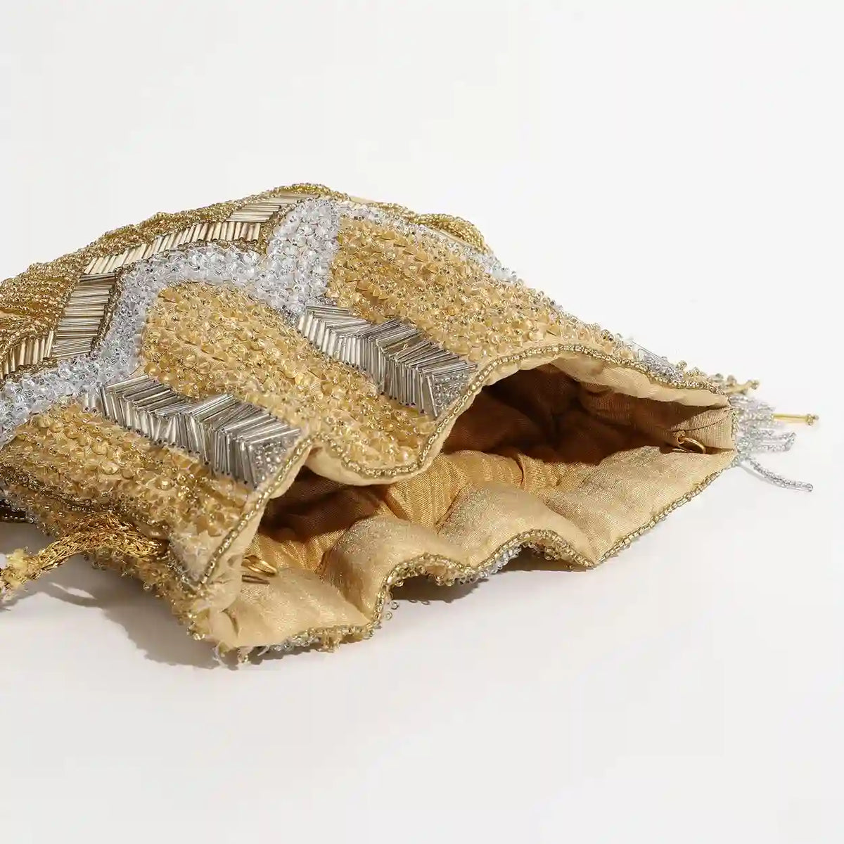 Elegant Jhoomar Potli bag with handle from The Tan Clan, featuring intricate embroidery and traditional design.