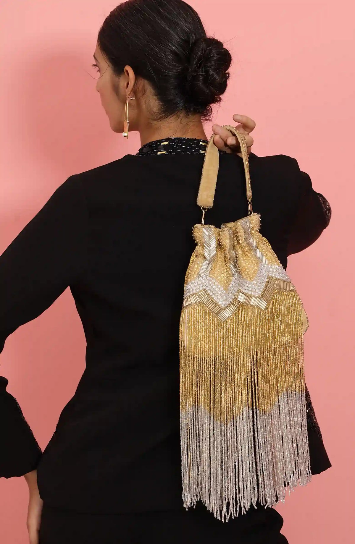 Jhoomar Potli bag with handle from The Tan Clan, featuring traditional embroidery and a compact, stylish design for festive occasions.