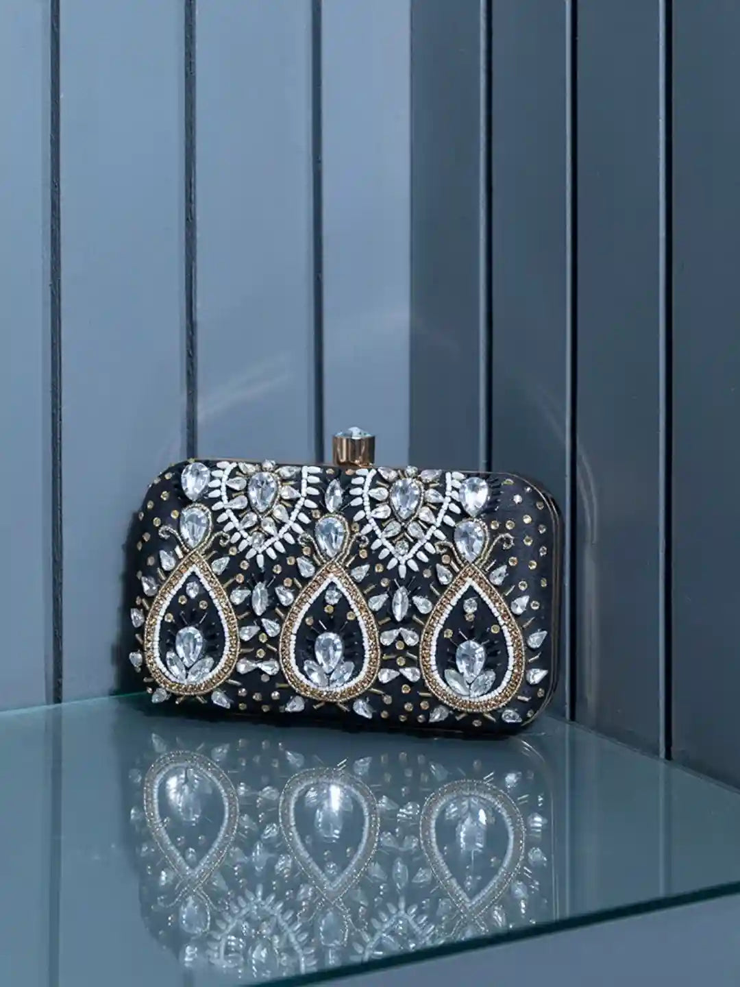 Kalah hand embroidered clutch by The Tan Clan featuring intricate embroidery and a sleek design for elegant occasions