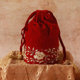 Red bridal Zardozi embroidered potli bag with intricate gold thread work, traditional Indian accessory by The Tan Clan.