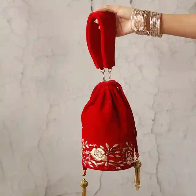 Red bridal Zardozi embroidered Potli bag with intricate gold threadwork, traditional bridal accessory by The Tan Clan.