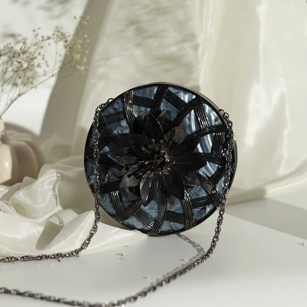 Laila clutch by The Tan Clan featuring intricate brass work and elegant mother of pearl detailing.