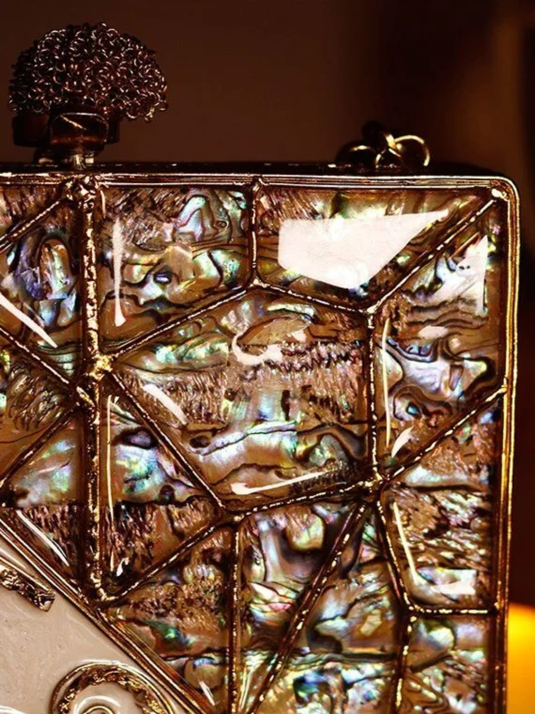Lihaaz Mother of Pearl brass clutch by The Tan Clan featuring intricate design and elegant craftsmanship.