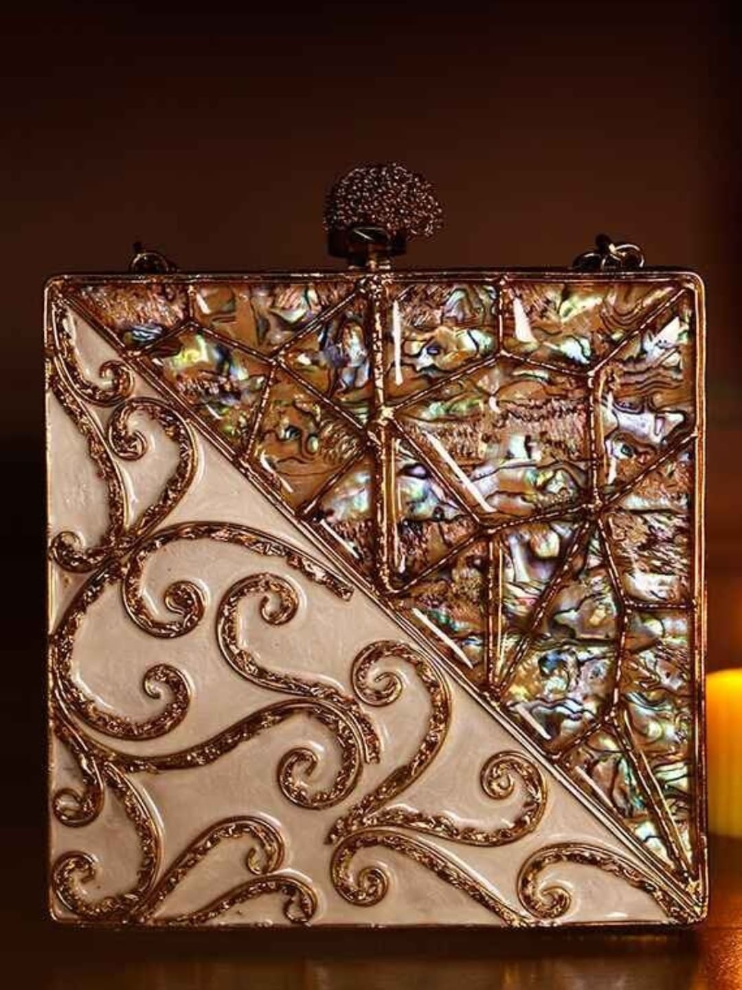 Lihaaz Mother of Pearl brass clutch by The Tan Clan with intricate pearl design and elegant metal clasp.