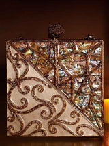 Lihaaz Mother of Pearl brass clutch by The Tan Clan with intricate pearl design and elegant metal clasp.