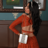 Liyana Mother of Pearl Clutch by The Tan Clan featuring iridescent pearl-embellished surface and elegant rectangular design.