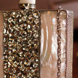 Liyana Mother of Pearl Clutch by The Tan Clan featuring a shimmering pearl finish and elegant rectangular design.