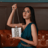 Liyana Mother of Pearl Clutch by The Tan Clan featuring iridescent pearl detailing and a sleek, elegant design.