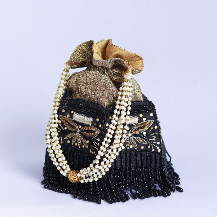 Hand-embroidered Magha Half Lotus Potli bag by The Tan Clan with intricate embroidery and traditional design.