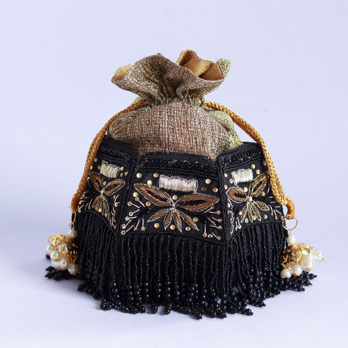 Hand embroidered Magha half lotus potli bag by The Tan Clan with intricate embroidery and traditional design.