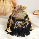 Hand embroidered Magha Half Lotus Potli bag by The Tan Clan with intricate embroidery and traditional design.