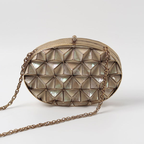 Maya 3D Mother of Pearl Clutch by The Tan Clan featuring iridescent pearl finish and elegant design for evening occasions.