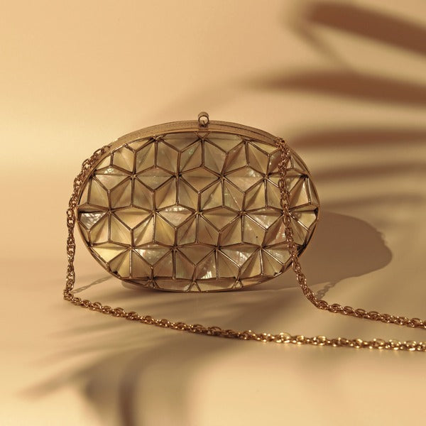 Maya 3D Mother of Pearl clutch by The Tan Clan with intricate 3D pearl design and elegant rectangular shape.