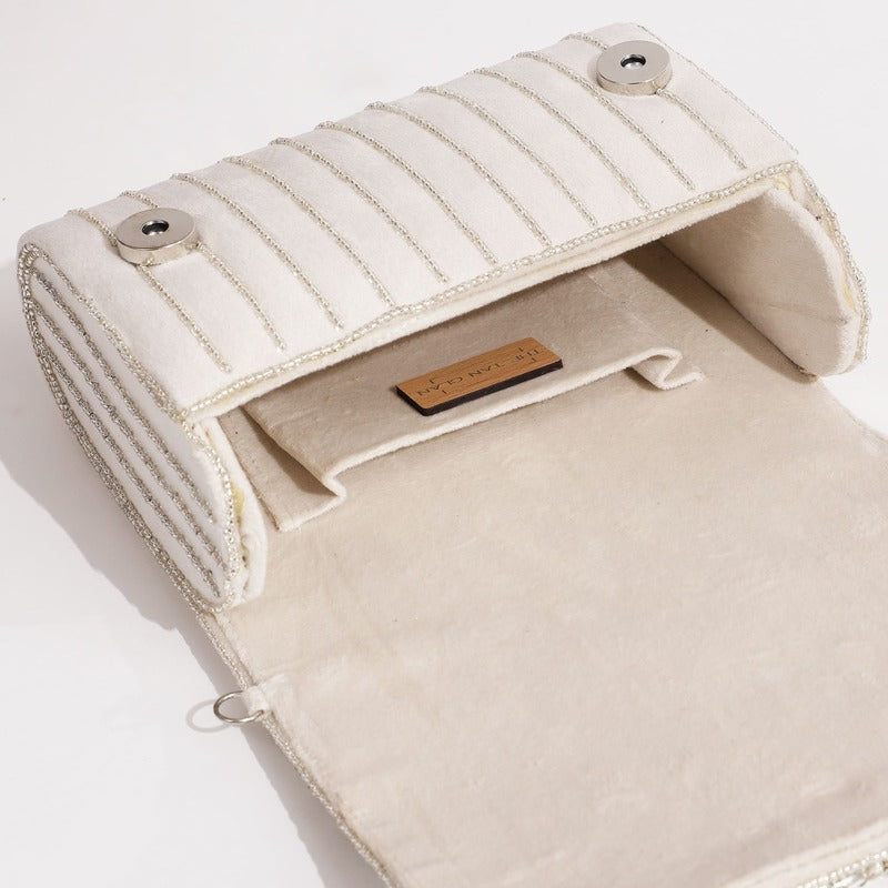 Mehfil combo featuring Noor mother of pearl clutch and Grace white flap bag with gold accents, stylish and elegant accessories.