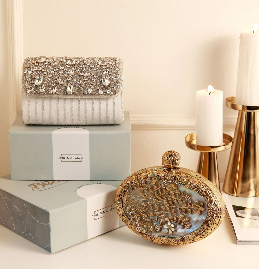 Mehfil combo featuring a Noor Mother of Pearl clutch and a Grace white flap bag, both with elegant designs and polished finishes.