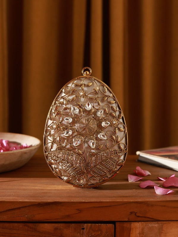 Mia Intricate Brass Clutch by The Tan Clan featuring detailed brass craftsmanship and elegant design.
