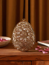 Mia Intricate Brass Clutch by The Tan Clan featuring detailed brass craftsmanship and elegant design.