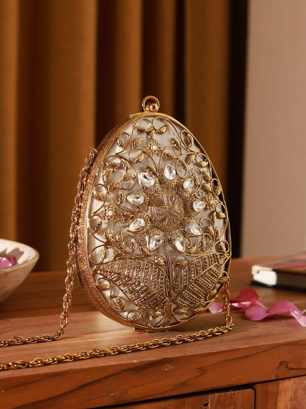 Elegant Mia Intricate Brass Clutch with detailed craftsmanship, featuring a sleek design and metallic finish by The Tan Clan