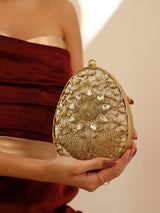 Mia Intricate Brass Clutch by The Tan Clan featuring detailed brass craftsmanship and elegant design.